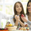 family together decorate eggs