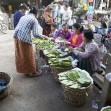 Burmese women in traditional clothes are sellign vegetables and fruit at the Nyang U market, Bagan, Myanmar. Located in the northeastern part of Bagan, Nyaung U market is Nyaung village's local market, where it is possible find goods in different section.