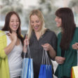 Group of young women shopping in a store or mall
