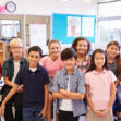 Elementary school teacher and her pupils in classroom