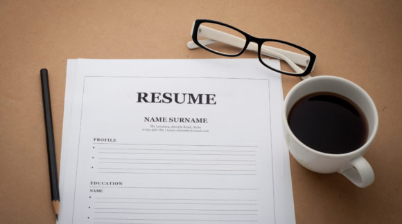 office desk with resume information, Coffee cup, black pencil an