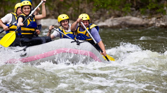 People whitewater rafting